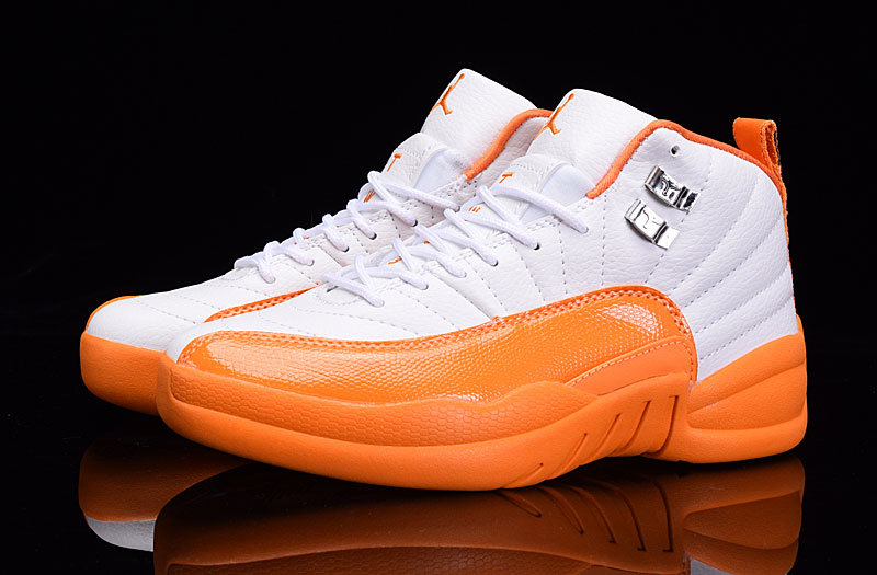 white and orange jordan 12