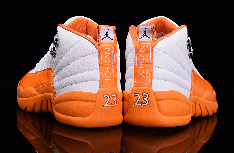 white and orange jordan 12