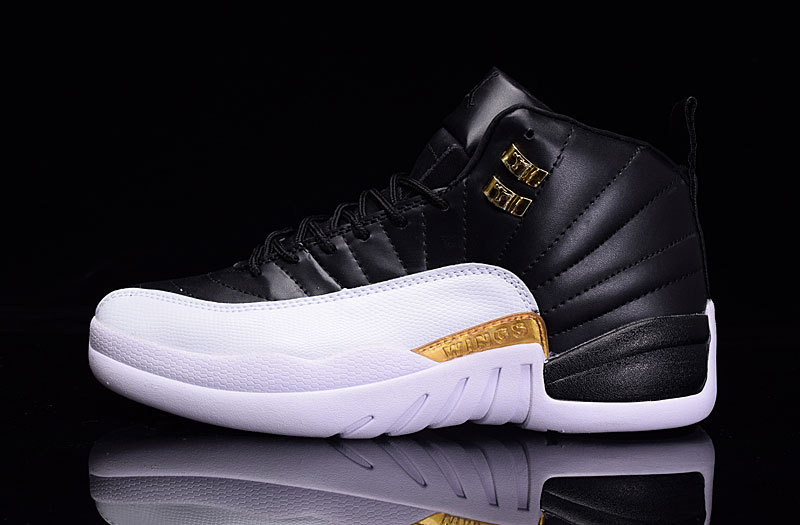 black jordans with gold logo